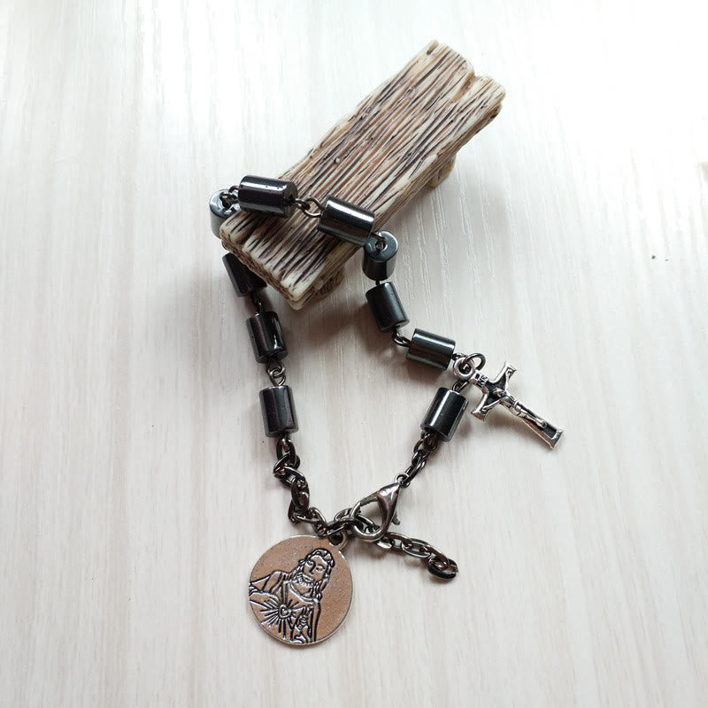 Bracelet en hématite représentant le Sacré-Cœur et le Crucifix de Jésus, signé Christianartworkshop, dans un esprit de simplicité. - image 1