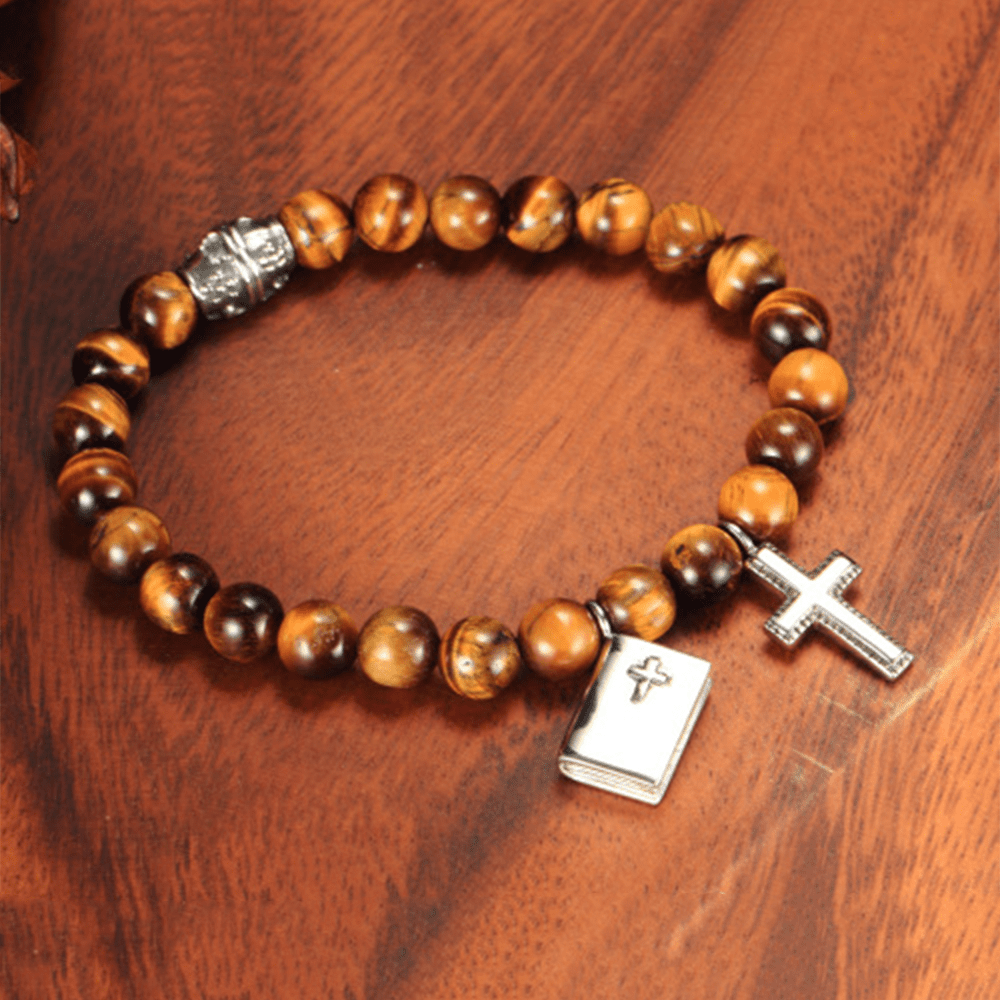 Bracelet en titane avec croix biblique et pierre œil de tigre, signé Christianartworkshop - image 1