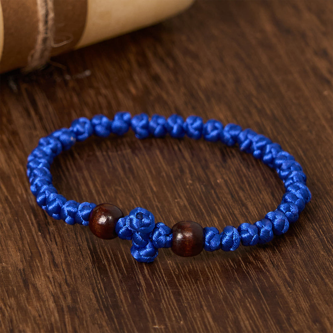 Bracelet en cordelette à nœud croix bleue et noire de Christianartworkshop : un gage de foi - image 11