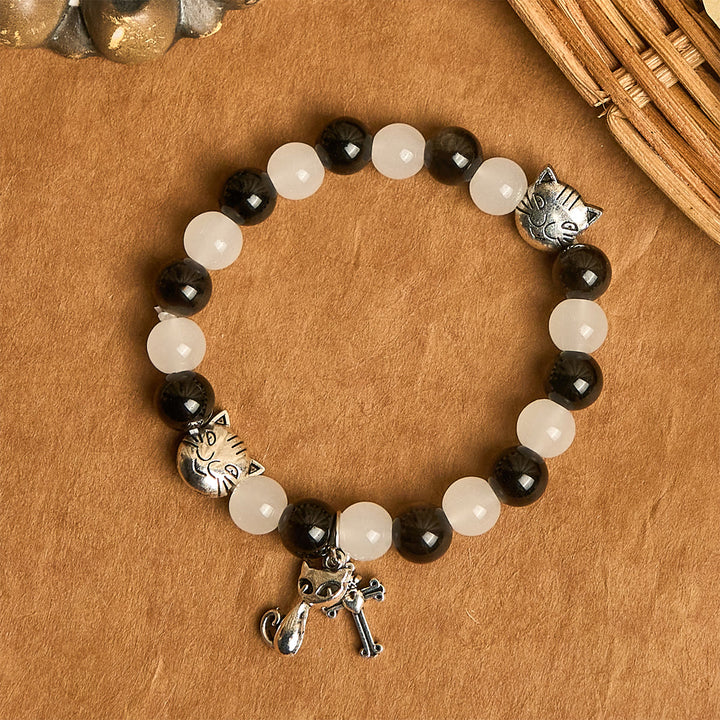 Christianartworkshop Bracelet animalier avec perles représentant une vache et un chat noirs et blancs, symbole de la bénédiction de Notre-Dame - image 4