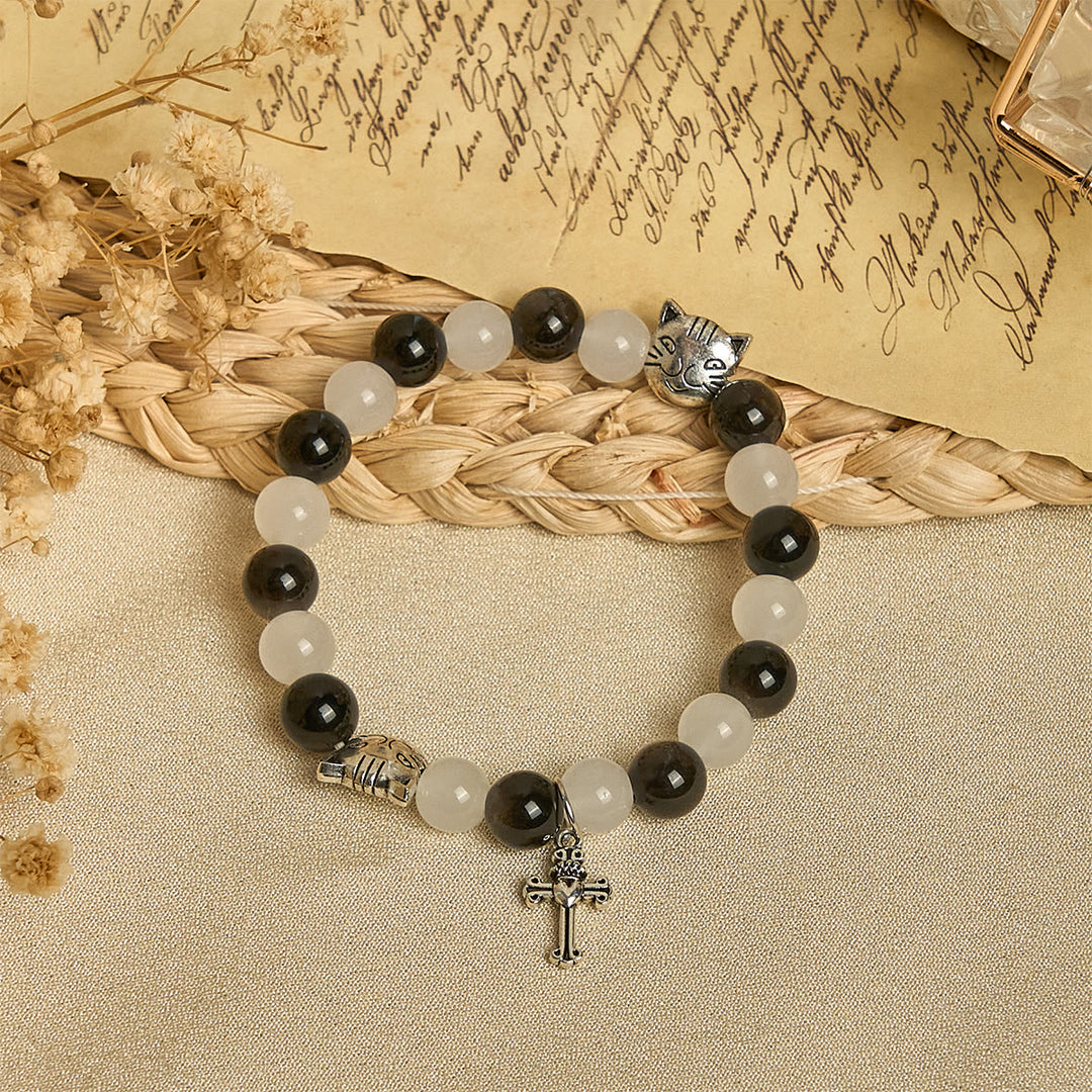 Christianartworkshop Bracelet animalier avec perles représentant une vache et un chat noirs et blancs, symbole de la bénédiction de Notre-Dame - image 2