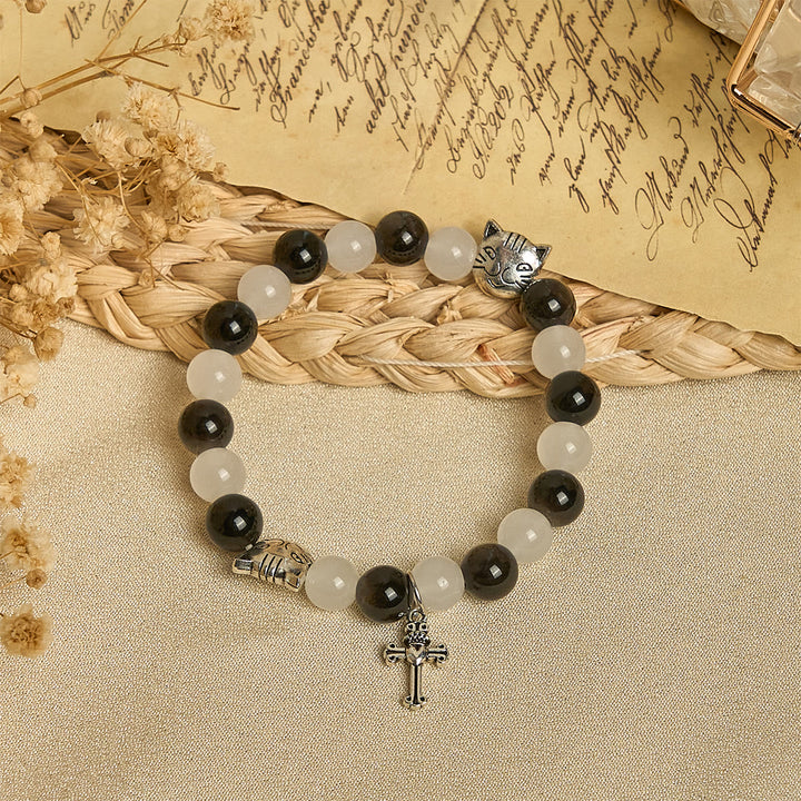 Christianartworkshop Bracelet animalier avec perles représentant une vache et un chat noirs et blancs, symbole de la bénédiction de Notre-Dame - image 2