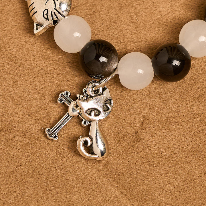 Christianartworkshop Bracelet animalier avec perles représentant une vache et un chat noirs et blancs, symbole de la bénédiction de Notre-Dame - image 6