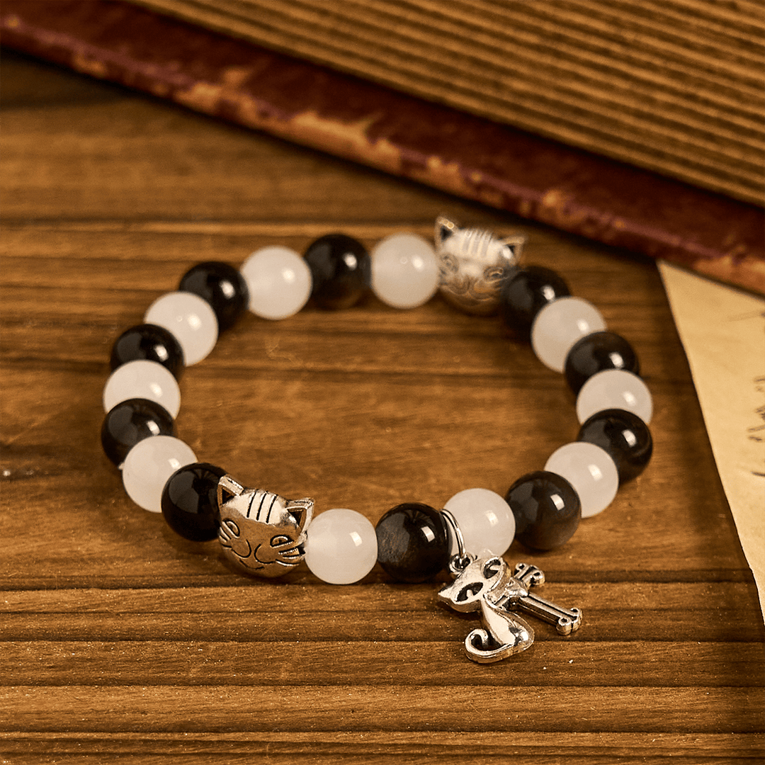 Christianartworkshop Bracelet animalier avec perles représentant une vache et un chat noirs et blancs, symbole de la bénédiction de Notre-Dame - image 5