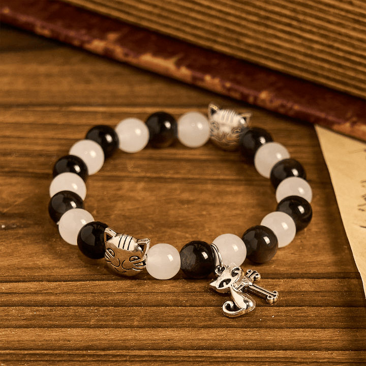 Christianartworkshop Bracelet animalier avec perles représentant une vache et un chat noirs et blancs, symbole de la bénédiction de Notre-Dame - image 5