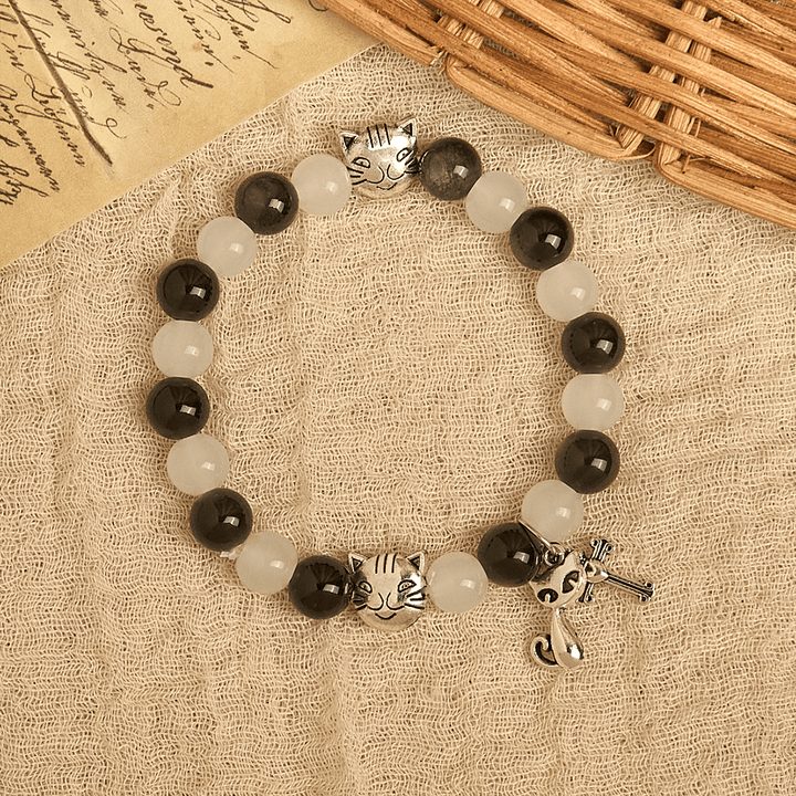 Christianartworkshop Bracelet animalier avec perles représentant une vache et un chat noirs et blancs, symbole de la bénédiction de Notre-Dame - image 3