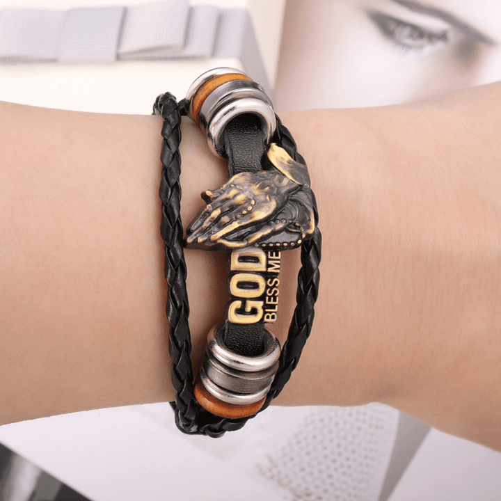 Bracelet Christianartworkshop rétro style mains jointes en prière, motif tressé noir « Que Dieu me bénisse ». - image 1
