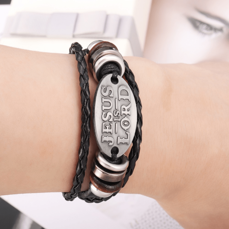 Bracelet en cuir tressé noir Christianartworkshop avec inscription « JÉSUS EST SEIGNEUR » - image 1
