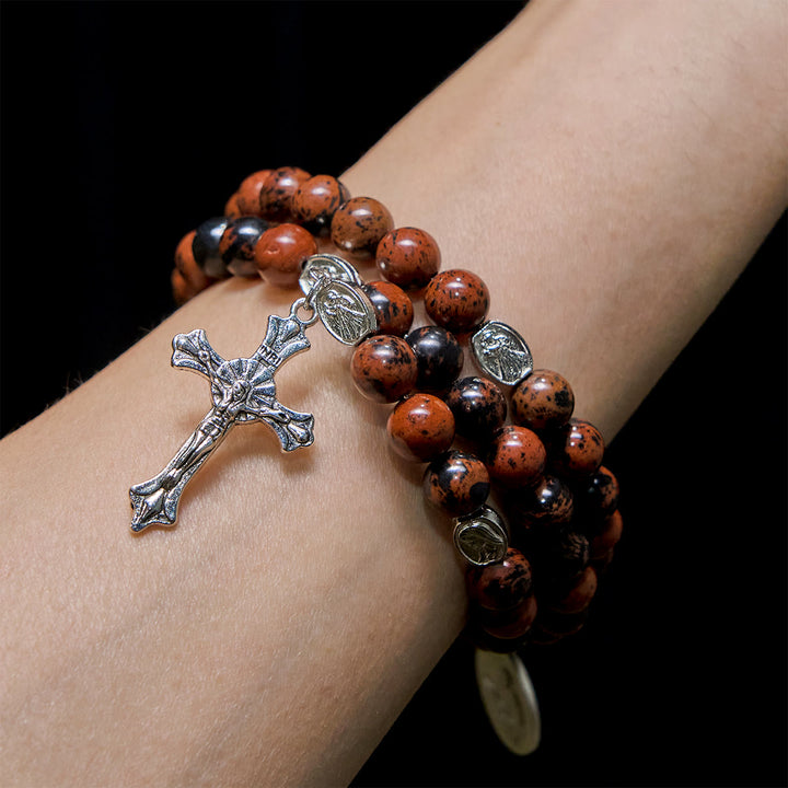 Christianartworkshop Bracelet chapelet en acajou naturel et obsidienne, fil mémoire, avec Jésus - image 1