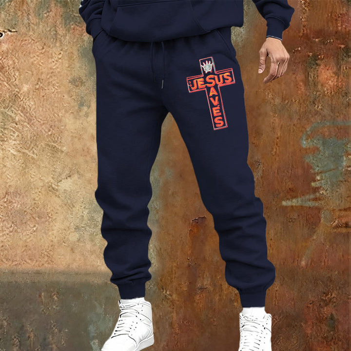 Atelier d'art chrétien - Croix et pantalon de survêtement « Jésus sauve » : un vêtement du quotidien lié à sa promesse - image 1