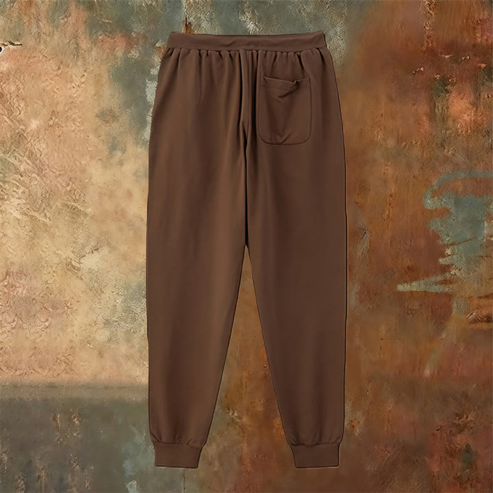 Atelier d'art chrétien - Croix et pantalon de survêtement « Jésus sauve » : un vêtement du quotidien lié à sa promesse - image 15