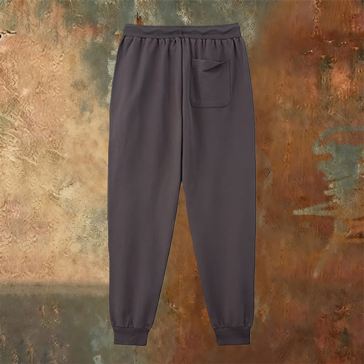 Atelier d'art chrétien - Croix et pantalon de survêtement « Jésus sauve » : un vêtement du quotidien lié à sa promesse - image 7