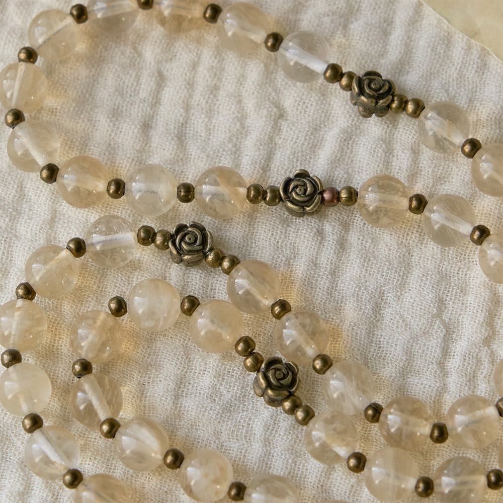 Christianartworkshop Chapelet en perles de verre ambré orné de camélias : un symbole de la lumière et de la pureté du Christ - image 4