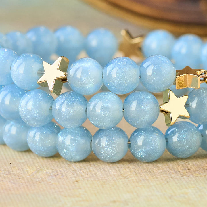 Christianartworkshop Bracelet enroulé de perles de verre bleues avec entretoises en forme d'étoile et crucifix doré - image 4
