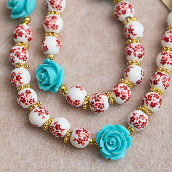 Christianartworkshop Chapelet des Sept Douleurs en perles de céramique rouge et blanche, orné d'une rose turquoise et d'une médaille de la Vierge Marie. - image 5