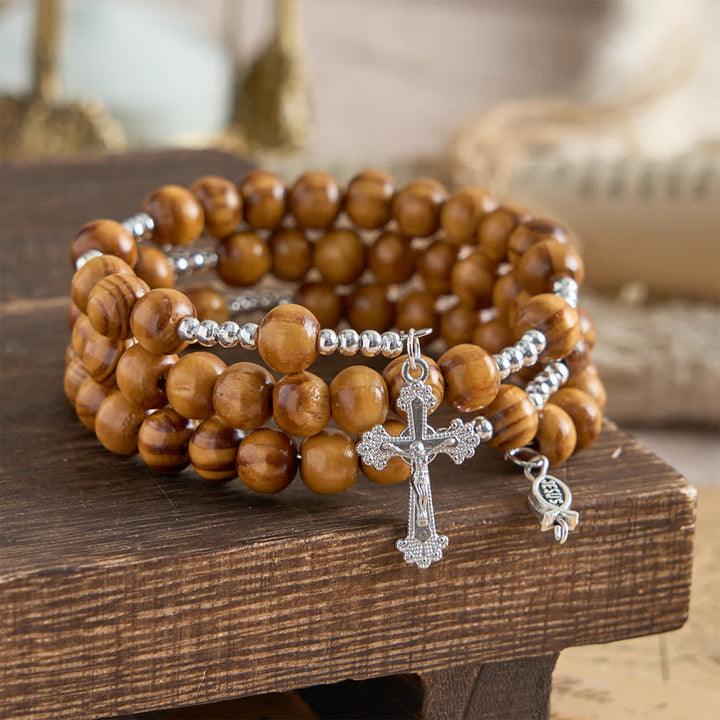 Christianartworkshop Bracelet chapelet en bois d'olivier naturel avec fil mémoire, orné d'Ichthys et d'un crucifix. - Tour de poignet : 18-23 cm (7,08-9,06 pouces) - image 0