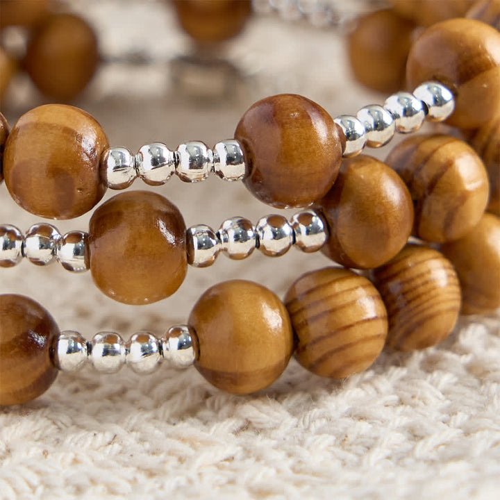 Christianartworkshop Bracelet chapelet en bois d'olivier naturel avec fil mémoire, orné d'Ichthys et d'un crucifix. - image 7