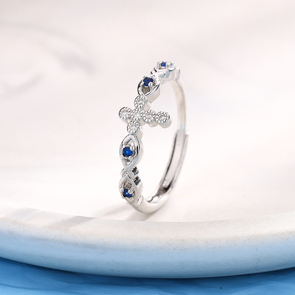 Christianartworkshop Bague croix délicate ornée de zircons bleus : un symbole de foi et de sérénité - image 3