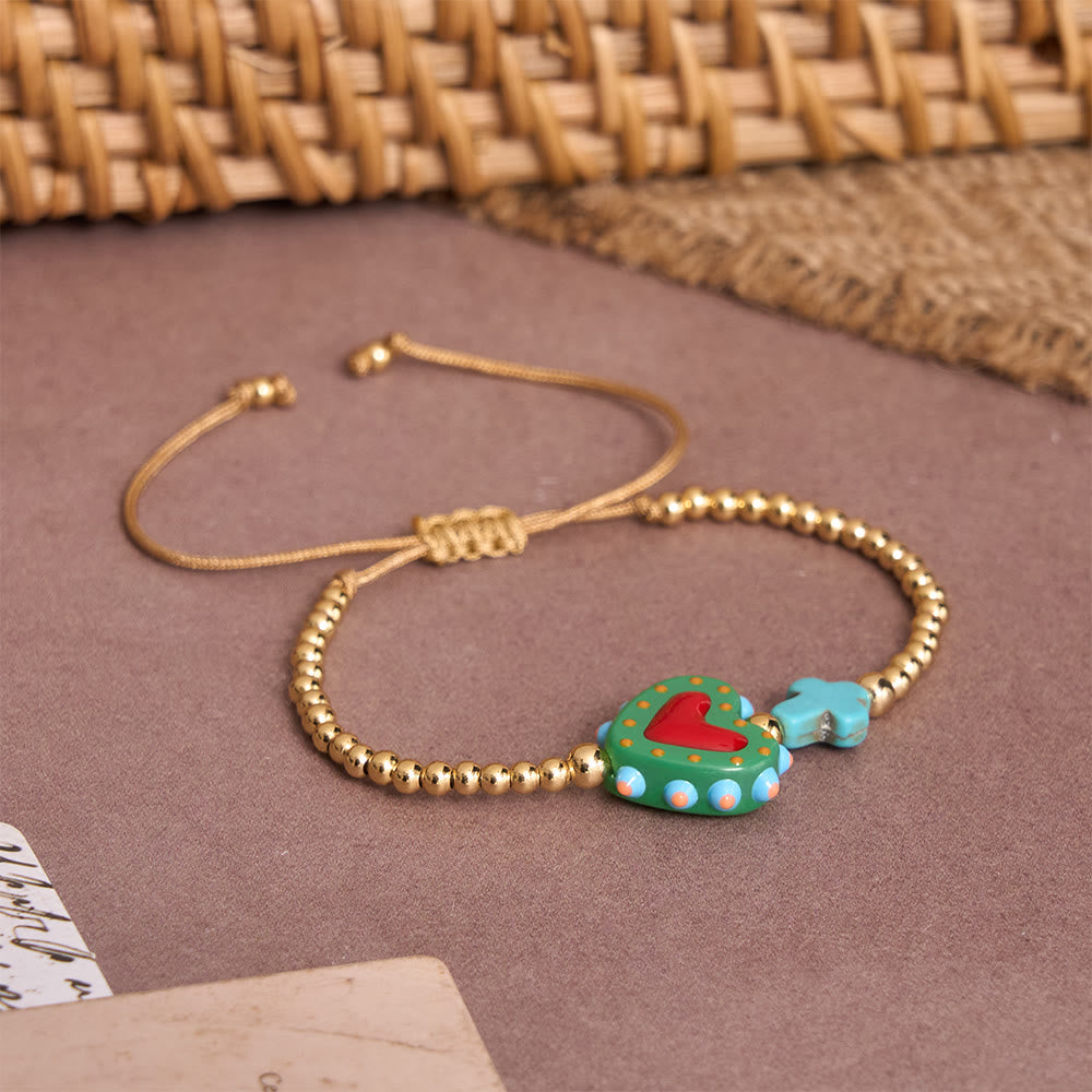 Christianartworkshop Bracelet ajustable en perles dorées, orné d'un cœur sacré décoré à la main, d'une petite croix et d'un motif de dessin animé. - image 13