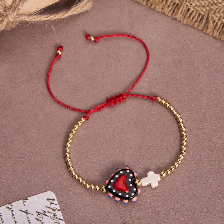 Christianartworkshop Bracelet ajustable en perles dorées, orné d'un cœur sacré décoré à la main, d'une petite croix et d'un motif de dessin animé. - UN - image 2