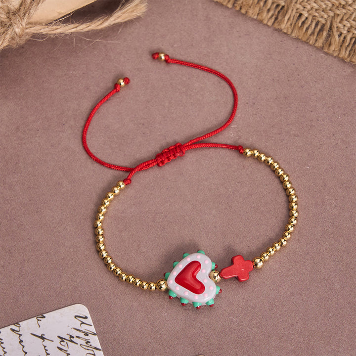 Christianartworkshop Bracelet ajustable en perles dorées, orné d'un cœur sacré décoré à la main, d'une petite croix et d'un motif de dessin animé. - E - image 10