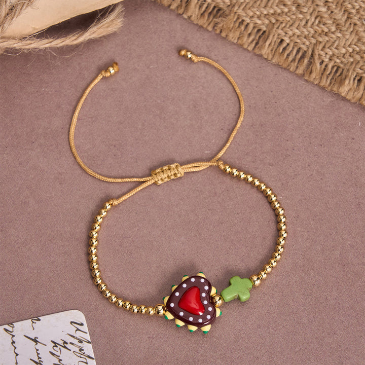 Christianartworkshop Bracelet ajustable en perles dorées, orné d'un cœur sacré décoré à la main, d'une petite croix et d'un motif de dessin animé. - D - image 8
