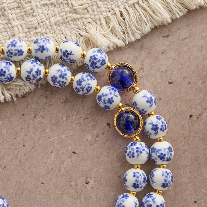 Christianartworkshop Chapelet en céramique bleu et blanc à motifs floraux, orné d'une élégante dévotion mariale - image 7